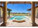 Relaxing backyard with a refreshing pool and spa, framed by elegant columns and picturesque golf course views at 2600 Cervino Cir, Henderson, NV 89052