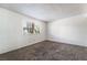 Bright, carpeted bedroom with a window providing natural light at 2667 Aracatuba Ave, Las Vegas, NV 89121