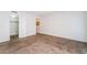 Bedroom features neutral carpet, white walls, and a walk-in closet with an open door at 2667 Aracatuba Ave, Las Vegas, NV 89121