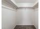 Walk-in closet with ample storage space and neutral carpeting at 2667 Aracatuba Ave, Las Vegas, NV 89121