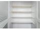 White, empty closet with multiple shelves, ready for ample storage at 2667 Aracatuba Ave, Las Vegas, NV 89121