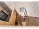 Low-angle view of a small courtyard with stucco walls, pavers and minimal landscaping at 2667 Aracatuba Ave, Las Vegas, NV 89121