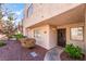Cozy condo unit featuring a private front entrance, small garden and desert rock landscape at 2667 Aracatuba Ave, Las Vegas, NV 89121