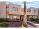 Attractive townhouse with a tidy front yard and desert-friendly plants enhancing its curb appeal at 2667 Aracatuba Ave, Las Vegas, NV 89121