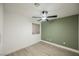 Neutral bedroom with wood-look floors, fan, and natural light at 2925 Wigwam Pkwy # 923, Henderson, NV 89074
