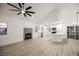 Bright living space featuring a fireplace, ceiling fan, and updated kitchen with stainless appliances at 2925 Wigwam Pkwy # 923, Henderson, NV 89074