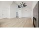 Spacious living room with modern fireplace, ceiling fan, and an open floor plan design at 2925 Wigwam Pkwy # 923, Henderson, NV 89074