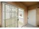 View through sliding glass door to a stylish living room with a fireplace and kitchen island at 2925 Wigwam Pkwy # 923, Henderson, NV 89074