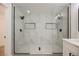Walk-in shower featuring stylish tile, glass enclosure, and modern fixtures at 2925 Wigwam Pkwy # 923, Henderson, NV 89074