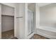 Bathroom featuring a shower, separate bathtub, and closet at 3008 Hot Cider Ave, North Las Vegas, NV 89031