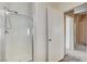 Bright bathroom featuring a glass-enclosed shower and neutral wall colors at 3008 Hot Cider Ave, North Las Vegas, NV 89031