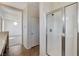 This bathroom features a glass enclosed shower, tile floor, and access to the bedroom at 3008 Hot Cider Ave, North Las Vegas, NV 89031