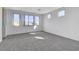 Well-lit bedroom with large windows offering neighborhood and mountain views at 3008 Hot Cider Ave, North Las Vegas, NV 89031