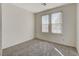 Bright bedroom with neutral carpet and two windows allowing ample natural light at 3008 Hot Cider Ave, North Las Vegas, NV 89031
