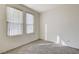 Comfortable bedroom features neutral carpet, two windows and sunny atmosphere at 3008 Hot Cider Ave, North Las Vegas, NV 89031
