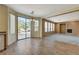 Open floor plan with dining area, fireplace, and sliding doors to the outdoor patio at 3008 Hot Cider Ave, North Las Vegas, NV 89031