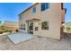 The home's exterior features a sliding glass door and gravel landscaping in the backyard at 3008 Hot Cider Ave, North Las Vegas, NV 89031