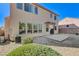 View of home's exterior shows a well-maintained lawn and sliding glass doors at 3008 Hot Cider Ave, North Las Vegas, NV 89031