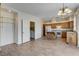 Well-lit open floor plan with view from pantry to kitchen and living area at 3008 Hot Cider Ave, North Las Vegas, NV 89031