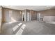 Large living room featuring neutral walls, carpet flooring and sunlit interior at 3008 Hot Cider Ave, North Las Vegas, NV 89031