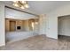 Spacious living room showcasing an open layout, fireplace, and view to the kitchen at 3008 Hot Cider Ave, North Las Vegas, NV 89031