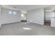 Open living room featuring neutral paint, plush carpet, and easy access to other rooms at 3008 Hot Cider Ave, North Las Vegas, NV 89031