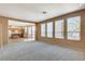 Bright living room with views of the kitchen and windows offering ample natural light at 3008 Hot Cider Ave, North Las Vegas, NV 89031