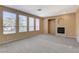 Spacious living room filled with natural light from the many windows and a cozy fireplace at 3008 Hot Cider Ave, North Las Vegas, NV 89031