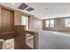 A loft space with neutral carpeting, windows, and recessed lighting at 3008 Hot Cider Ave, North Las Vegas, NV 89031