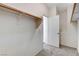 Walk-in closet offering generous storage with wood rod and open door, showcasing the carpet flooring at 3008 Hot Cider Ave, North Las Vegas, NV 89031