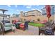 Backyard featuring lounge seating, patio, artificial turf and trimmed garden at 333 Canary Song Dr, Henderson, NV 89011