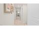 Hallway with neutral walls, plush carpet, and framed photos for an inviting feel at 333 Canary Song Dr, Henderson, NV 89011