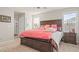 Cozy bedroom featuring a queen size bed, plush bedding, and abundant natural light at 333 Canary Song Dr, Henderson, NV 89011