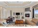 Bright living room with a fireplace and coffered ceilings at 37 Avenida Fiori, Henderson, NV 89011