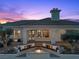 Covered patio with a fire pit and built in bench seating at 37 Avenida Fiori, Henderson, NV 89011