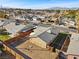 Aerial view of a home with a desert landscaped backyard and mountain views in the distance at 4432 Ash Ave, Las Vegas, NV 89110