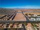 Discover the perfect neighborhood with this aerial view showcasing residential homes adjacent to open spaces at 4434 Verdiccio Ave, Las Vegas, NV 89141