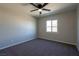 Bedroom features a ceiling fan, new carpet and a window for natural light at 457 Federal St, Henderson, NV 89015