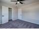 Bedroom features plush carpet, a ceiling fan, and a spacious closet at 457 Federal St, Henderson, NV 89015