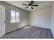 Cozy bedroom with a ceiling fan, carpeted floors and natural light at 457 Federal St, Henderson, NV 89015