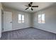 Bedroom features plush carpet, two windows for ample light, and a ceiling fan at 457 Federal St, Henderson, NV 89015