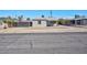 Charming single story home with gravel yard, covered porch, and convenient driveway access at 457 Federal St, Henderson, NV 89015