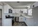 Updated kitchen featuring modern appliances, bright lighting and new hardware at 457 Federal St, Henderson, NV 89015