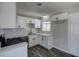 Modern kitchen with white cabinets, stainless steel appliances, and sleek countertops at 457 Federal St, Henderson, NV 89015