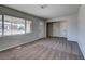 Spacious living room with plush carpeting, neutral colors, and abundant natural light at 457 Federal St, Henderson, NV 89015
