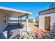 Covered back patio with brick extension and storage shed at 457 Federal St, Henderson, NV 89015