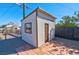 Storage shed, set in a gravel-filled backyard at 457 Federal St, Henderson, NV 89015