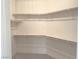 Walk-in closet with shelving and carpet at 4695 E Lucera Ct, Pahrump, NV 89061
