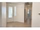 Light and bright entryway with decorative glass front door and tile floors at 4695 E Lucera Ct, Pahrump, NV 89061