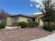 Attractive single-story home featuring desert landscaping, mature tree and a stone veneer facade at 4695 E Lucera Ct, Pahrump, NV 89061